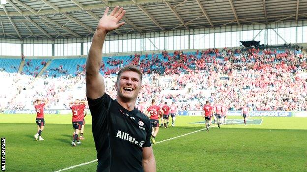 Owen Farrell smiles and waves at the crowd