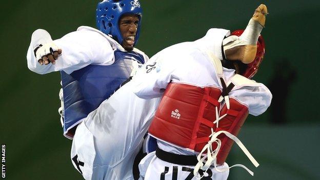 Chika Chukwumerije of Nigeria fights Akmal Irgashev of Uzbekistan in the Men's +80kg category for a 2008 Olympic bronze medal