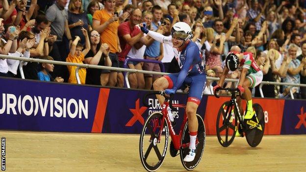 Ethan Hayter waves to the crowd after winning omnium European gold