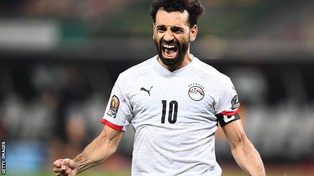 Mohamed Salah celebrates his winning penalty against Ivory Coast