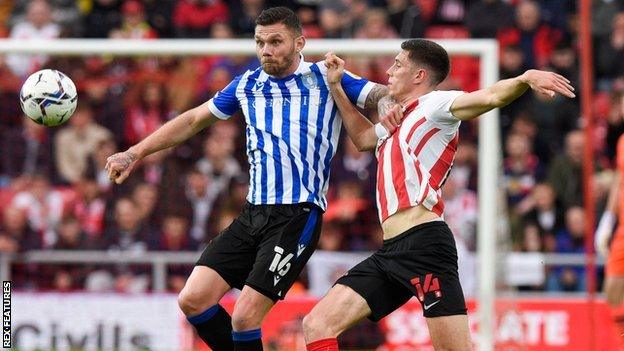 Harlee Dean (left) during his loan spell with Sheffield Wednesday