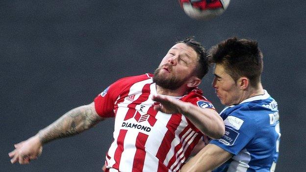 Derry's Rory Patterson battles with St Pat's player Lee Desmond at the Brandywell