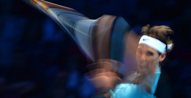 Spain's Rafael Nadal returns to Spain's David Ferrer during a men's singles group stage match