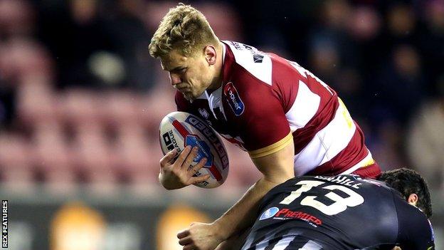 Ryan Sutton is challenged by Widnes Vikings' Hep Cahill