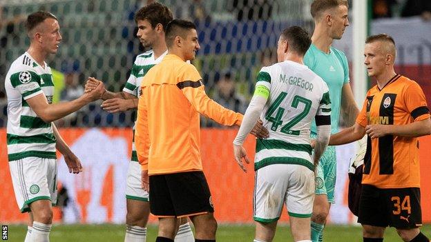 Celtic and Shakhtar Donetsk players shake hands