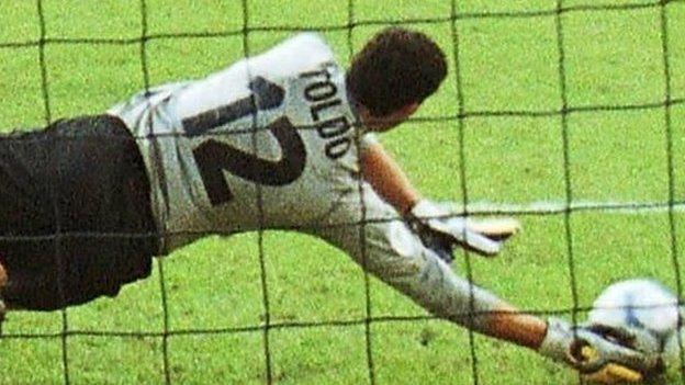 Italy's Toldo saves a penalty