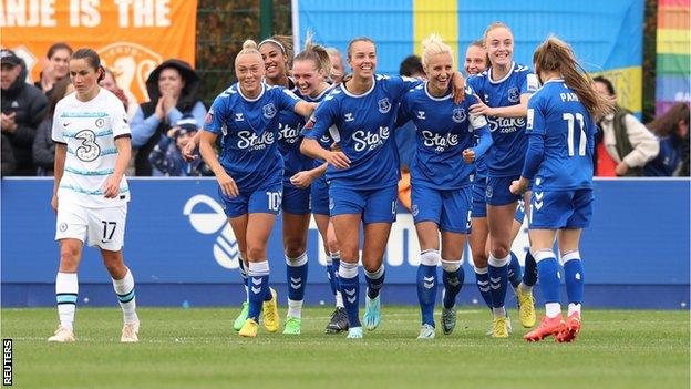 Everton's players celebrate scoring against Chelsea