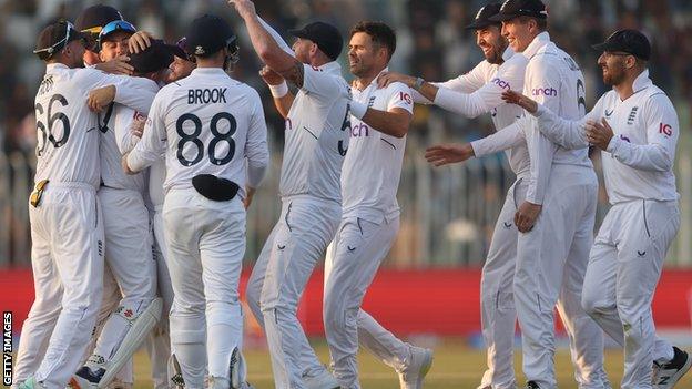 Ollie Pope celebrates taking a catch