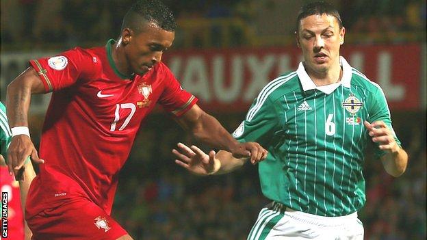 Chris Baird (right) in action against Nani of Portugal