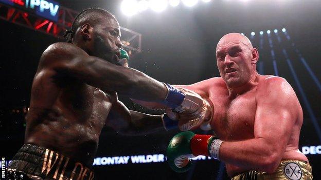 Deontay Wilder (l) and Tyson Fury