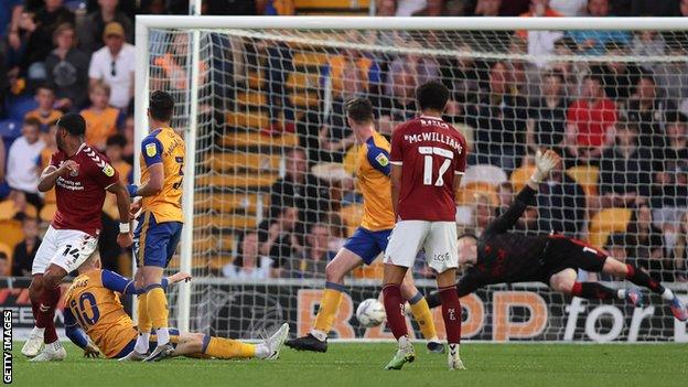 Ali Koiki of Northampton Town scores