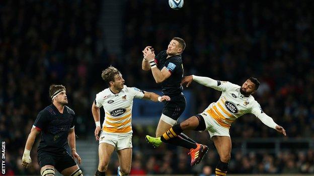 Harlequins' Mike Brown goes up for a high ball against Wasps