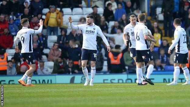 Oliver Burke celebrates his goal