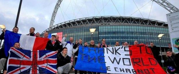 Fans arrive early at Wembley Stadium before the friendly game