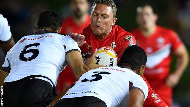 Christiaan Roets runs into heavy Fijian defence