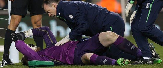 Rob Elliot was carried off with a bad-looking knee injury in the first half