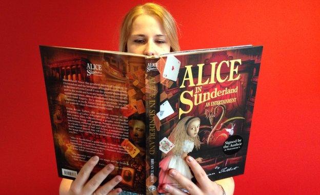 A lady reads Alice in Sunderland