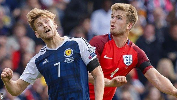 Stuart Armstrong and Eric Dier contest possession