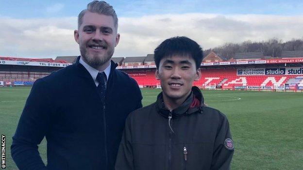 Accrington goalkeeper Connor Ripley with Korean fan Jung Min Yoo