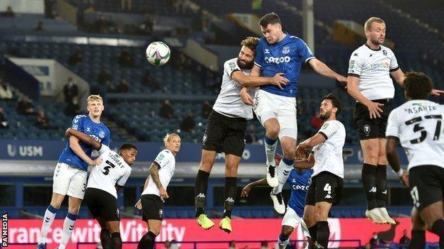 Michael Keane heads home a corner to give Everton the lead against Salford City