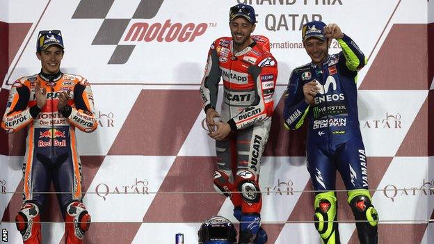 Repsol Honda Team"s Spanish rider Marc Marquez (L, 2nd place), Ducati Team"s Italian rider Andrea Dovizioso (C, 1st place) and Movistar Yamaha MotoGP"s Italian rider Valentino Rossi (R, 3rd place