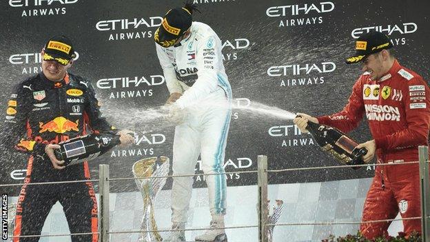 Max Verstappen, Lewis Hamilton and Charles Leclerc on the podium after the 2019 Abu Dhabi Grand Prix