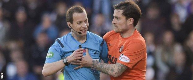 Willie Collum shares a joke with Dundee United midfielder Paul Paton