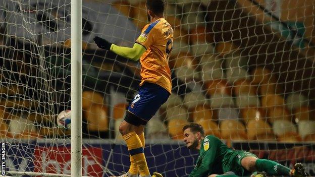 Jordan Bowery scores Mansfield's second goal against Salford City