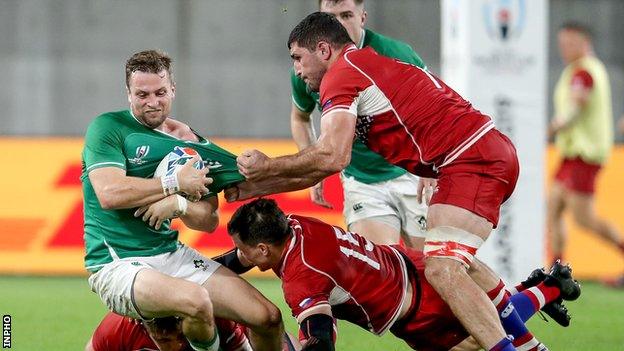 Jack Carty is tackled by Russia's Vasily Artemyev and Tagir Gadzhiev after replacing Johnny Sexton at half-time