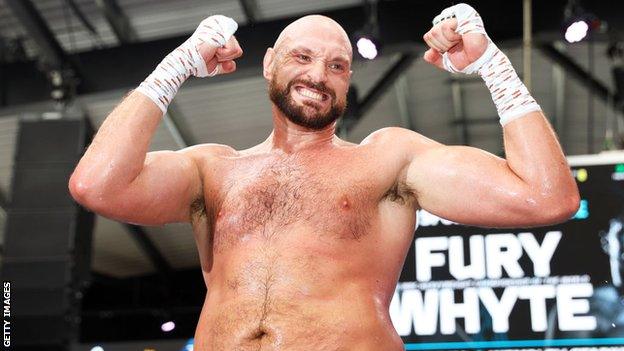 Tyson Fury poses for pictures