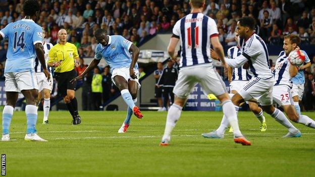 Manchester City midfielder Yaya Toure scores against West Brom