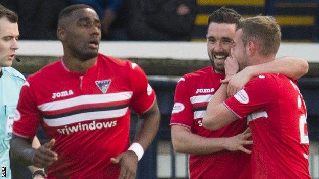 Nicky Clark (centre) celebrates scoring for Dunfermline