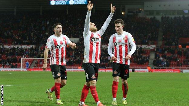 Alex Pritchard celebrates Sunderland's third goal against Morecambe