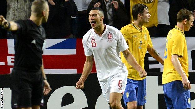 Steven Caulker celebrates his goal against Sweden on his England debut