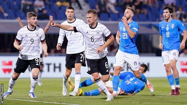 Joshua Kimmich (centre) celebrates scoring