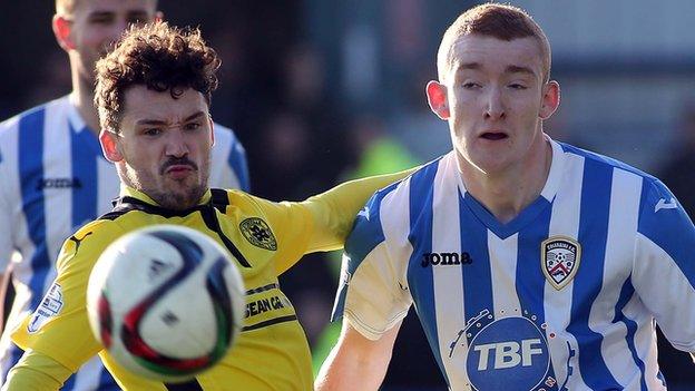 Cliftonville's Tomas Cosgrove battles with Coleraine's Rodney Brown