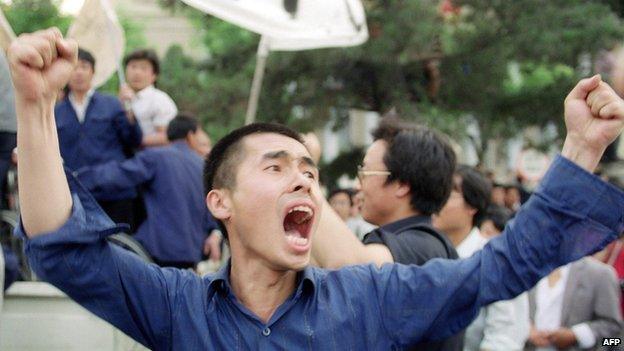 Picture dated 17 May 1989 shows a Chinese worker shouting pro-democracy slogans during a mass rally in Beijing streets in support of student hunger strikers gathered at Tiananmen Square, the scene of the mass pro-democracy protest led by students against the Chinese government