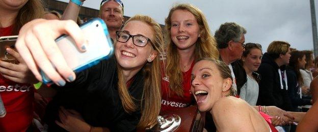 England skipper Kate Richardson-Walsh celebrates with fans after the victory