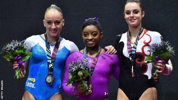 Silver medallist, Netherlands' Sanne Wevers, gold medallist Simone Biles and bronze medallist Pauline Schaefer, of Germany