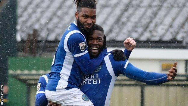 Nathan Blissett is congratulated by Macc team-mate Tyrone Marsh after scoring one of his five goals on loan from Plymouth last season