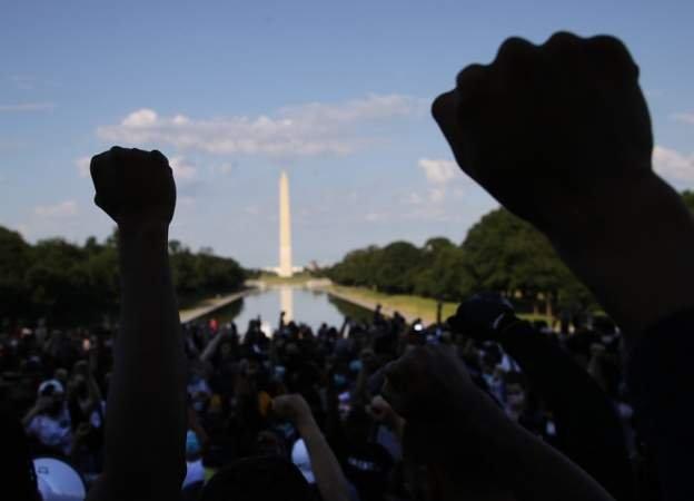 Many thousands were involved in the peaceful marches in Washington that were mainly centres around the main buildings and symbols of the US nation - such as the White House and here at the Washington Monument.