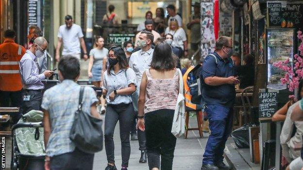 People walk around the shops and cafes in Melbourne's Central Business District