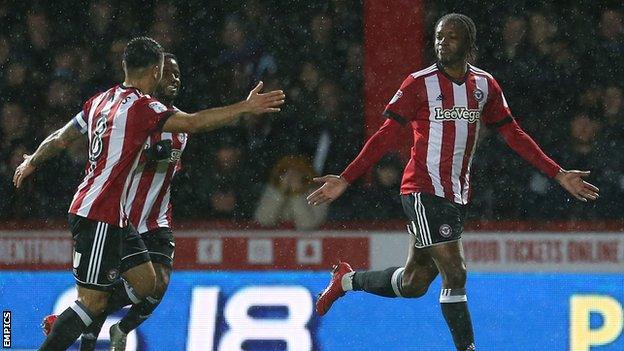 Brentford celebrate Romaine Sawyers' opening goal