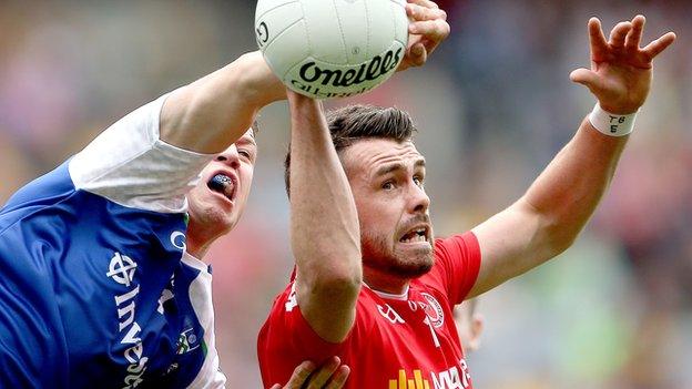 Tyrone's Darren McCurry battles with Monaghan's Ryan Wylie