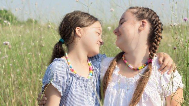 Girls playing in a field