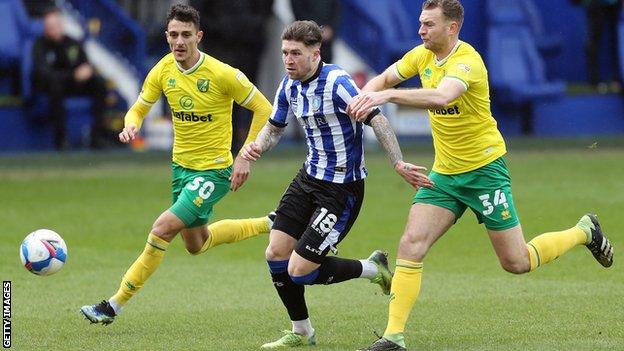 Ben Gibson (right) and Dimitris Giannoulis (left) in action for Norwich City