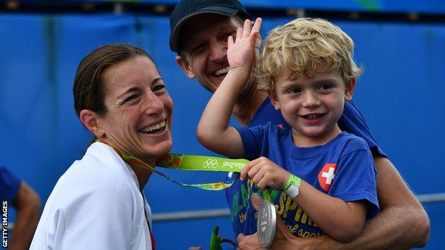 Nicola Spirig's son Yannis holds her silver medal