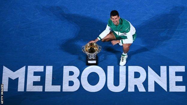 Novak Djokovic with the Australian Open trophy