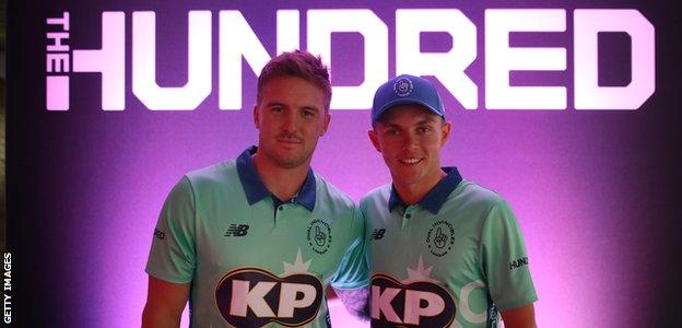 England's Jason Roy and Sam Curran pose in Oval Invincibles shirts