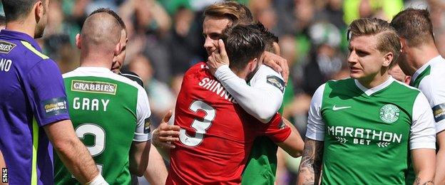 Graeme and Andrew Shinnie embrace